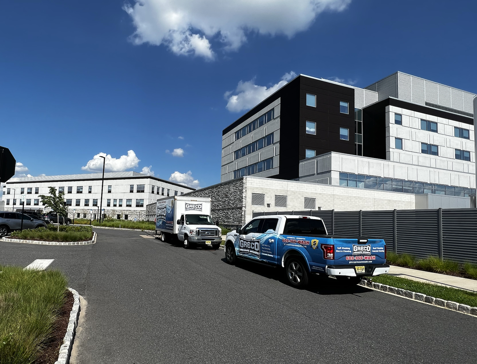 Pressure washing and soft washing a tall commercial building in mullica hill new jersey